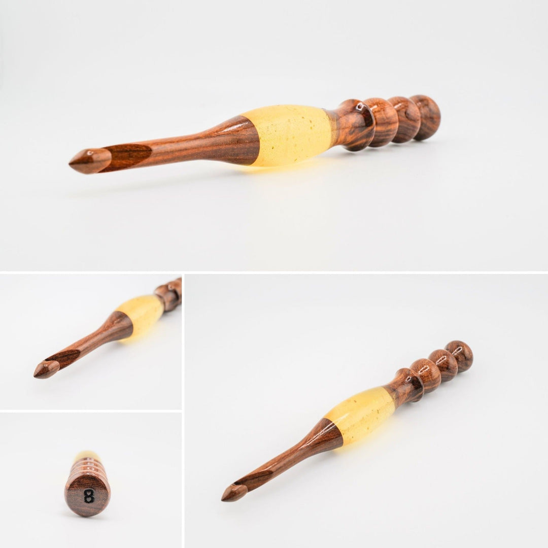 A wooden and resin crochet hooks.