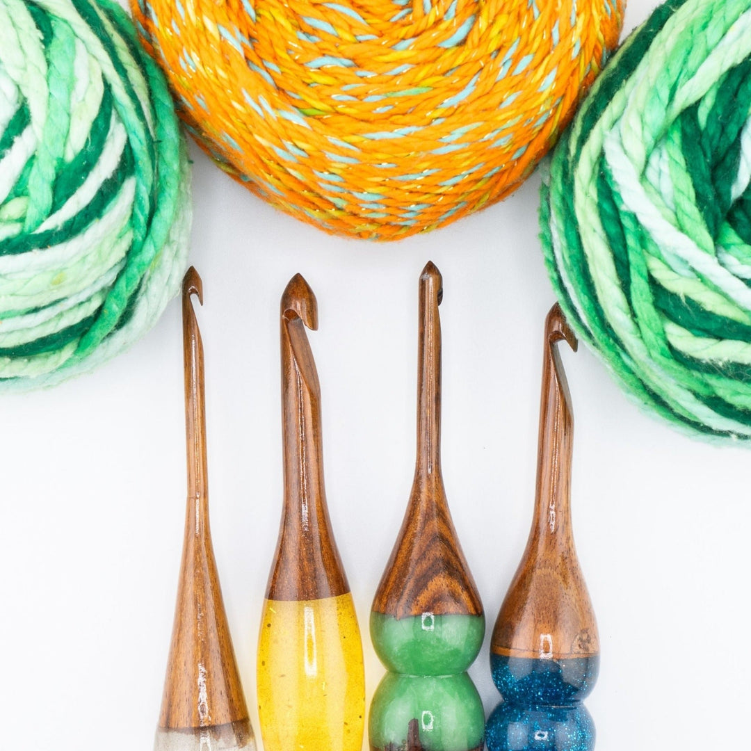 Wooden and Resin Crochet Hooks with rolled yarns.