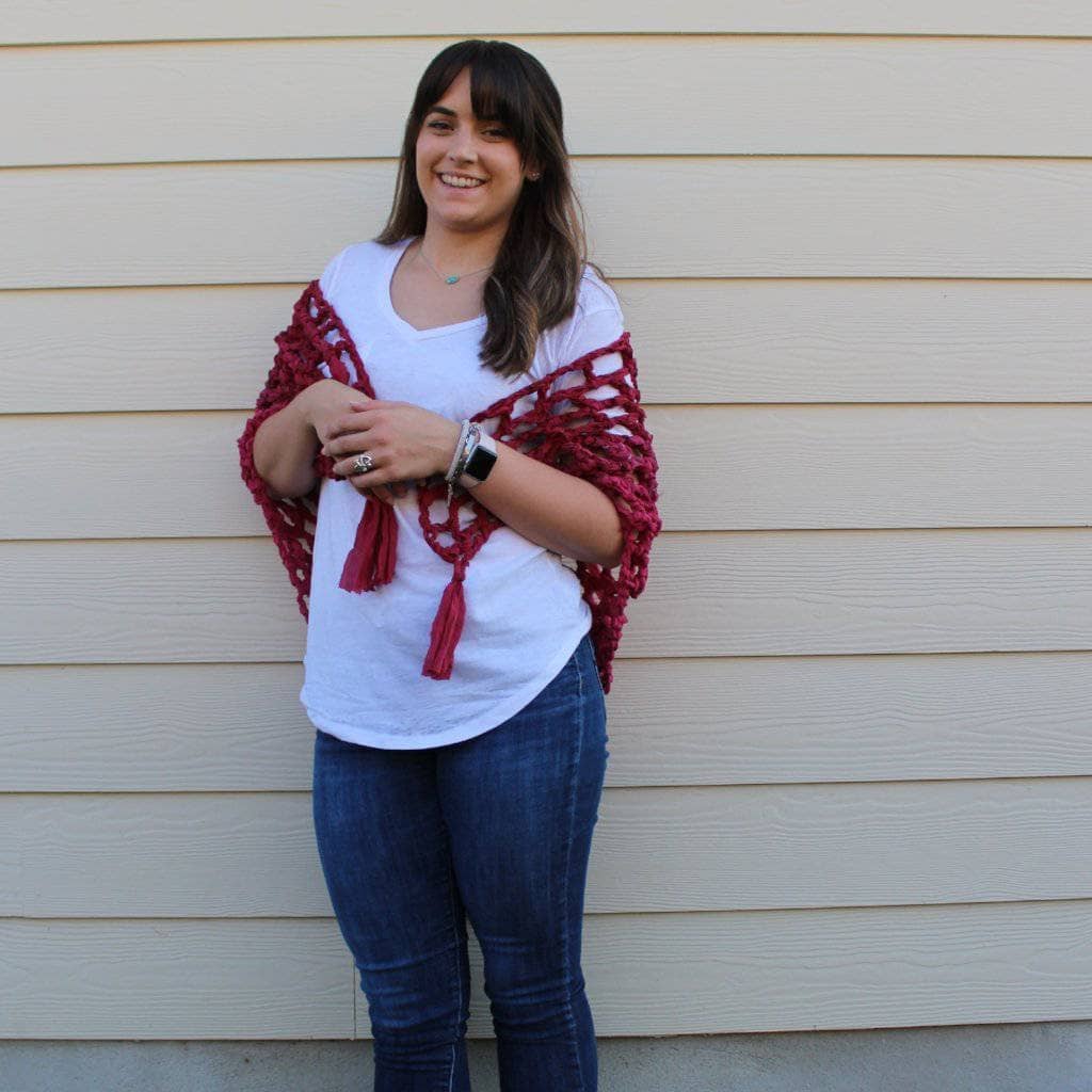 Woman wearing Summer Nights Chiffon Crochet Shawl in front of a beige wall