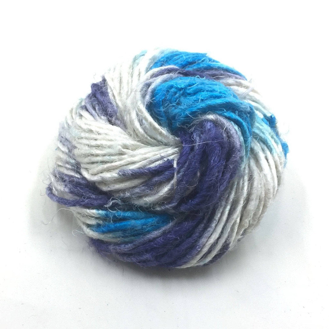 Banana fiber yarn donut ball in Ikat Indigo on a white background