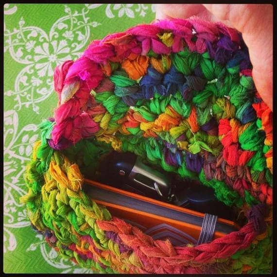 Tara's Clutch in multicolored on a bright green background