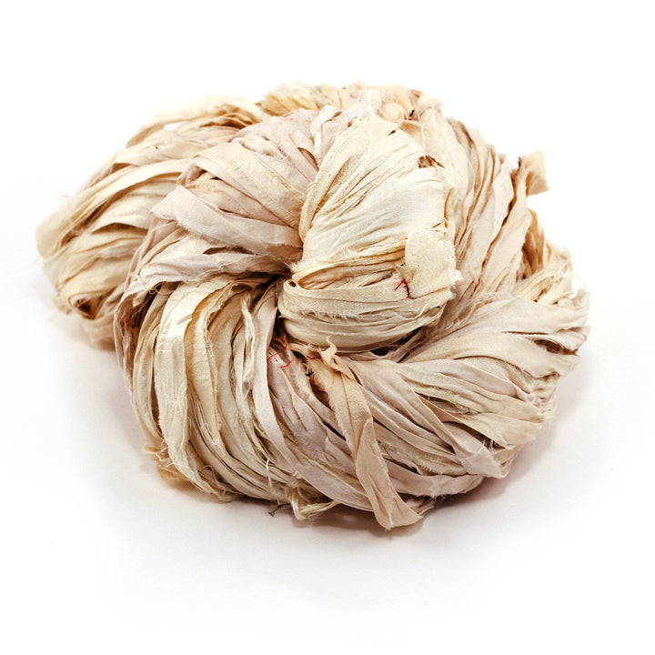 Sari Silk Ribbon Yarn ball in Vintage Ivory on a white background