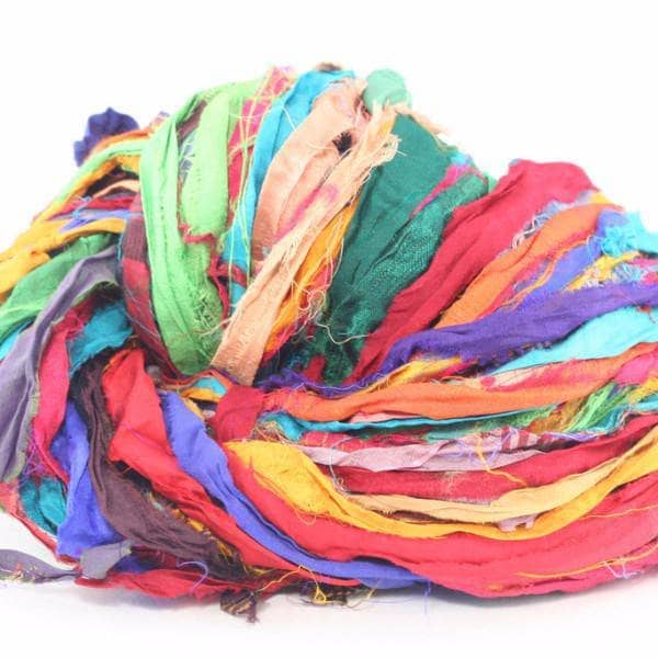 Sari Silk Ribbon yarn ball in Tibet Jewels (multicolored) on a white background