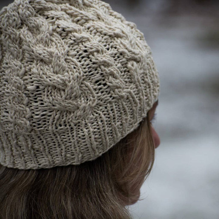 Woman wearing The Magnolia Beanie on a white background