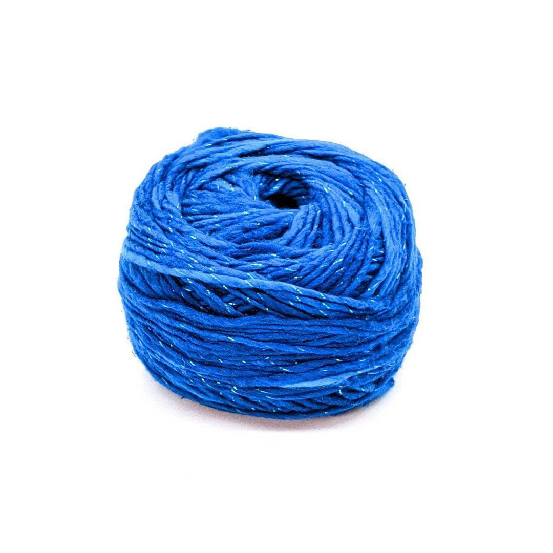 A cake of sparkle blue yarn on a white background