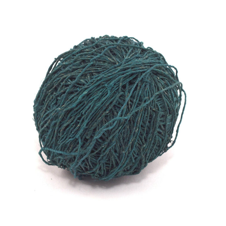 vegan yarn hemp blue hand spun in front of a white background.