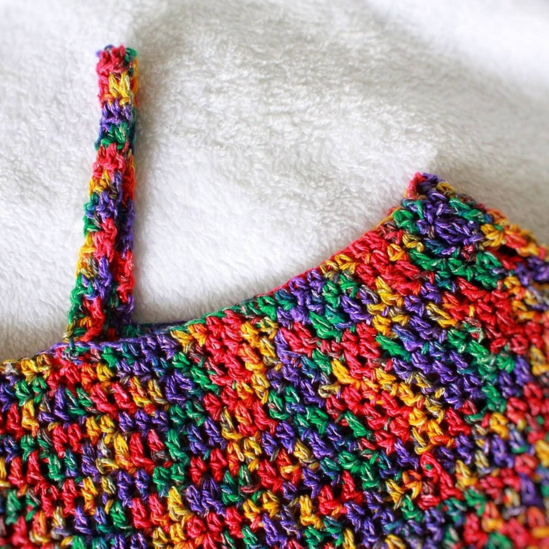 closeup image of sundaze top at neckline to shoulder strap detail