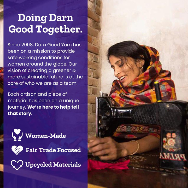 A woman sewing with vibrant fabric, promoting fair trade and sustainability