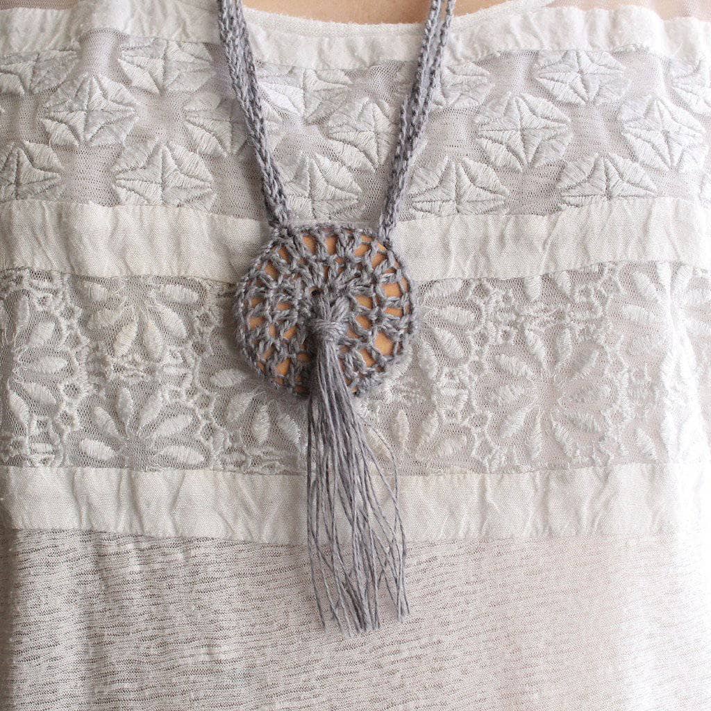 Woman wearing white shirt and Boho Macrame Necklace in gray