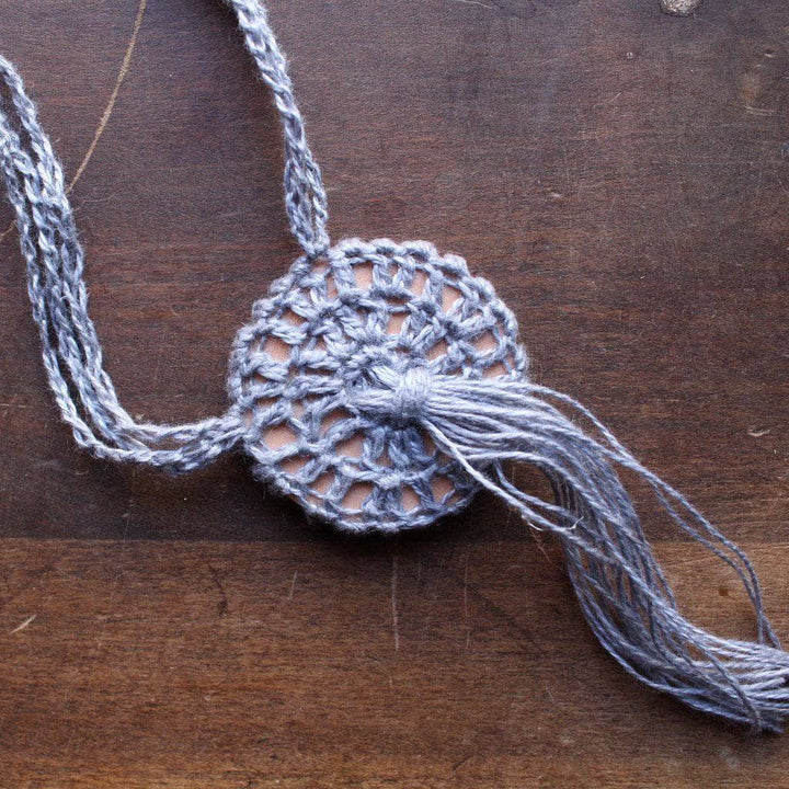 Boho Macrame Necklace in gray on a wooden background