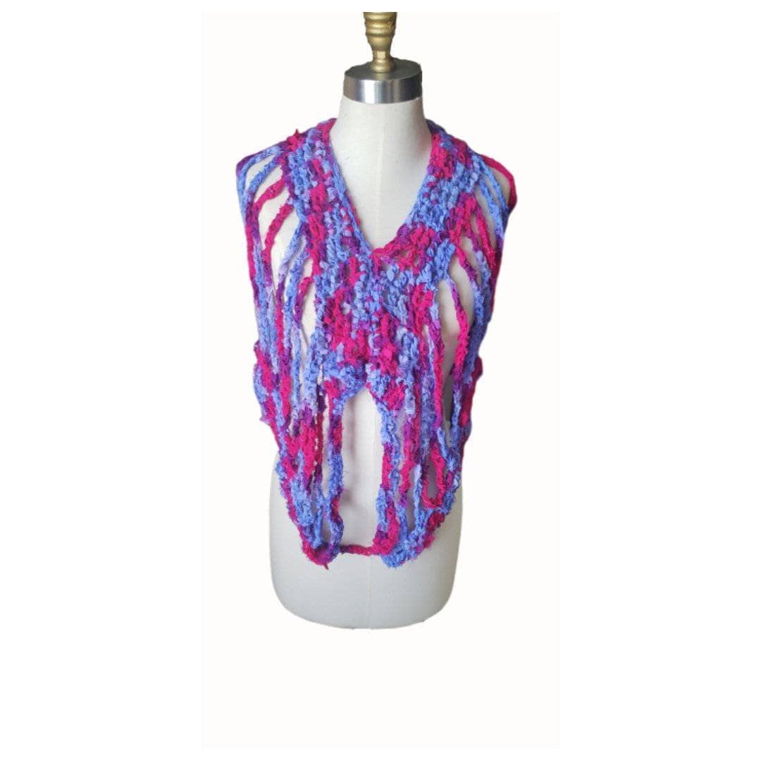 Purple and pink crocheted top on a white mannequin on a white background