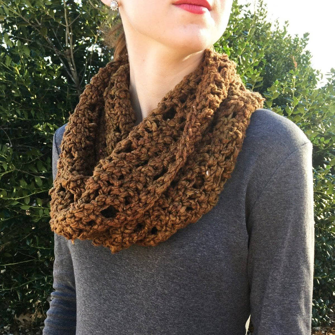 close up of a woman wearing a brown shawl